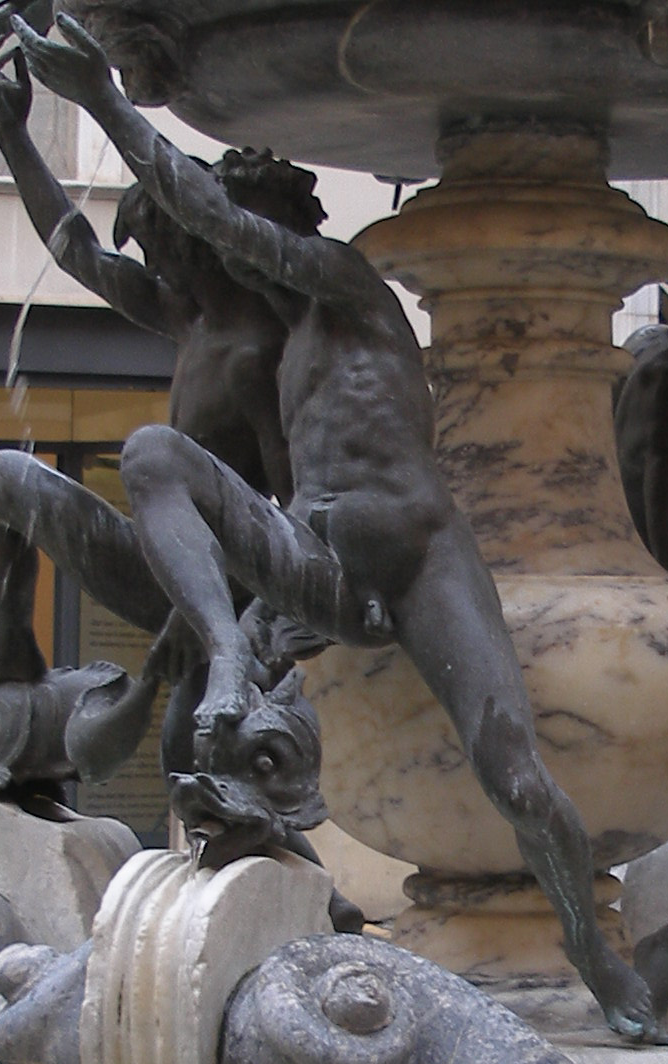 youth on the Fontana della Tartarughe in Rome