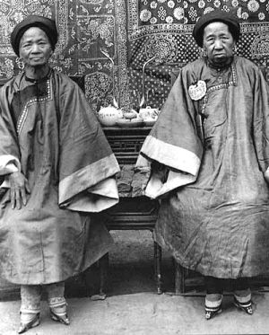 Two Chinese women with (concealed) bound feet